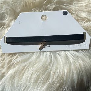 Choker necklace with gold cross